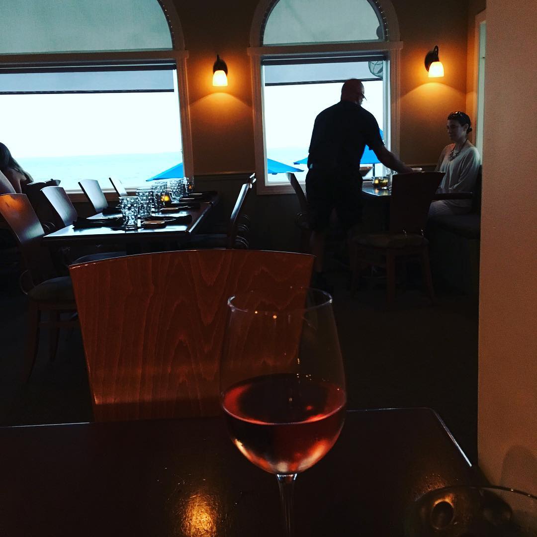 After nearly 6 hour drive, I am on the OBX. Celebrating with a cold glass of rosé. Come see me tomorrow 9-11 am @duckscottage, then 2-4pm in Manteo at @downtownbooksmto